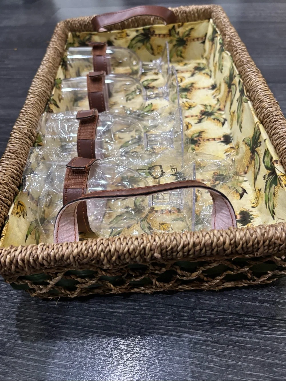 Vintage wicker and tropical palm green picnic basket service for four